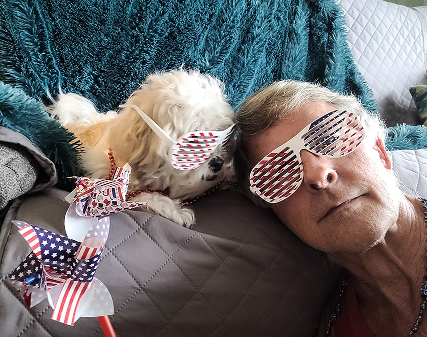 dog celebrating with his owner after eating a delicious USA dog food on 4th of July